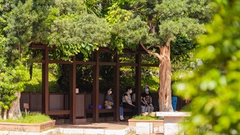 Shelters with benches offer a place for users to rest with a peaceful vista of the garden.